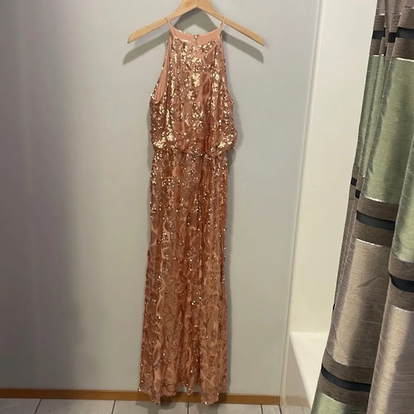 Donna Morgan woman’s rose gold Tiffany gown